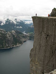 180px-Lysefjorden_-_Man_standing_on_Preikestolen.JPG